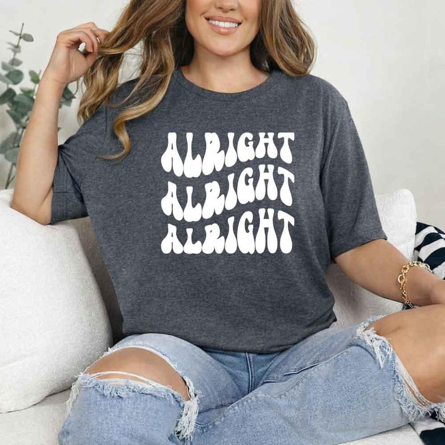 May include Dark Heather group in colorful tie-dye shirts reading “Dazed & Engaged,” smiling at a bachelorette party, with bride in veil and fun, festive vibe!
