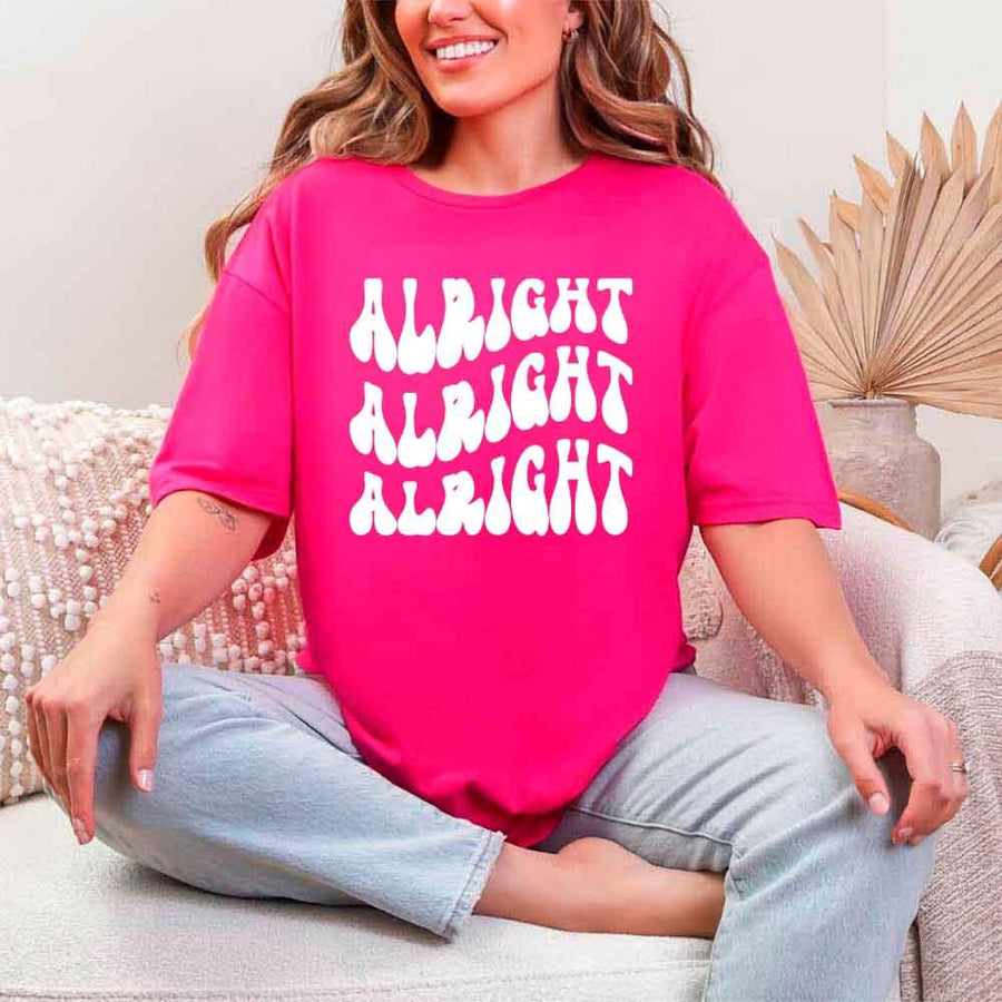 May include Heliconia group in colorful tie-dye shirts reading “Dazed & Engaged,” smiling at a bachelorette party, with bride in veil and fun, festive vibe!