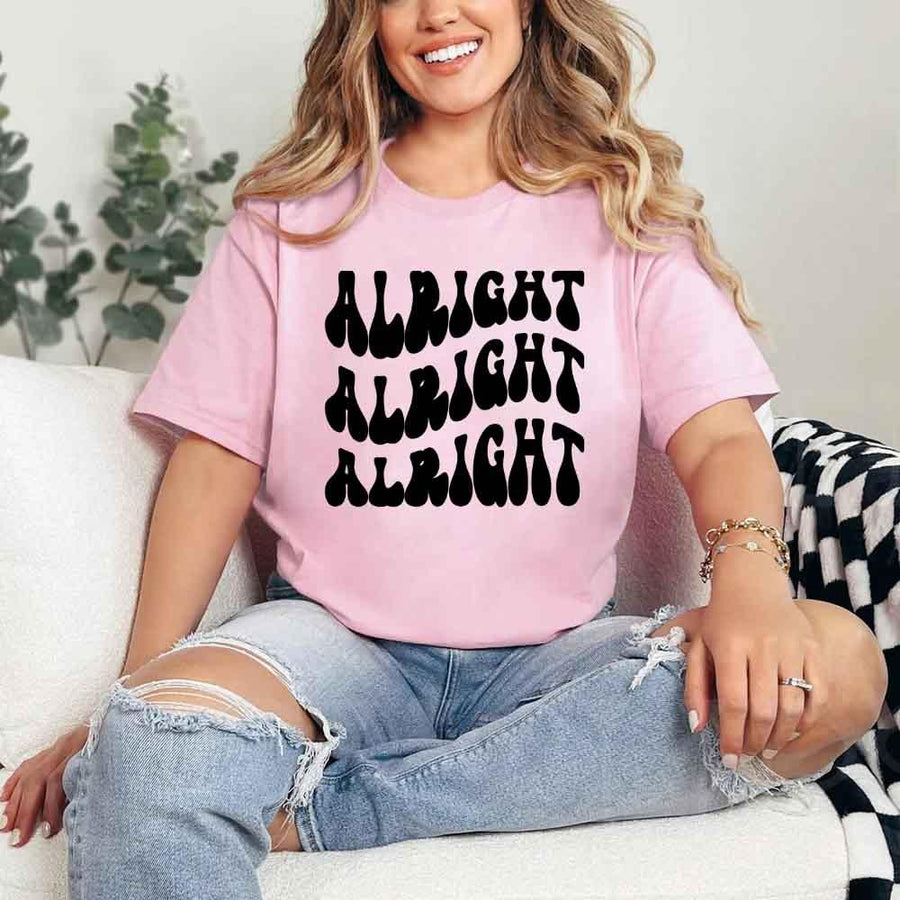 May include Pink group in colorful tie-dye shirts reading “Dazed & Engaged,” smiling at a bachelorette party, with bride in veil and fun, festive vibe!