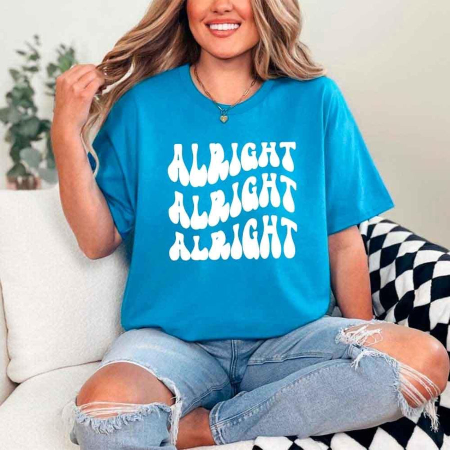 May include Sapphire group in colorful tie-dye shirts reading “Dazed & Engaged,” smiling at a bachelorette party, with bride in veil and fun, festive vibe!