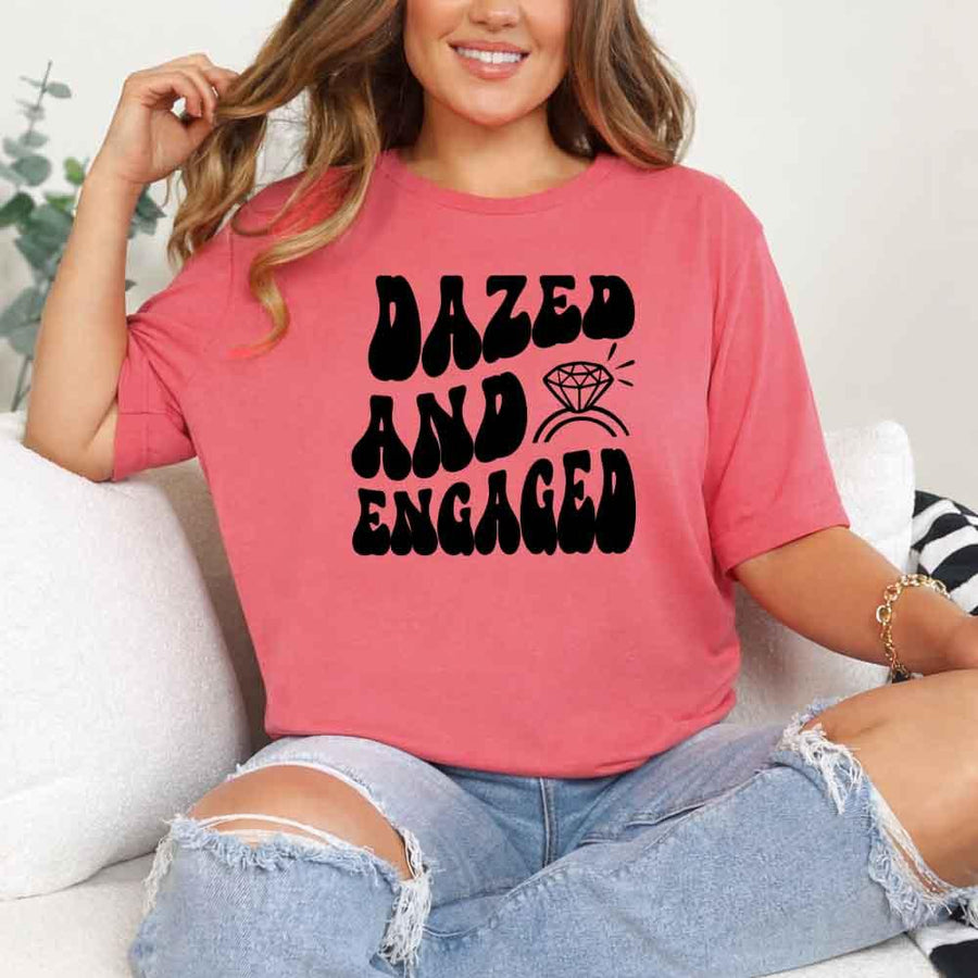 May include Coral Silk group in colorful tie-dye shirts reading “Dazed & Engaged,” smiling at a bachelorette party, with bride in veil and fun, festive vibe!