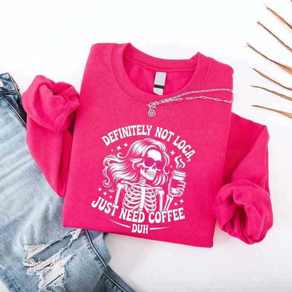 May include a women’s long sleeve shirt with the phrase “Definitely Not Loca” printed on the front in a casual, stylish design.