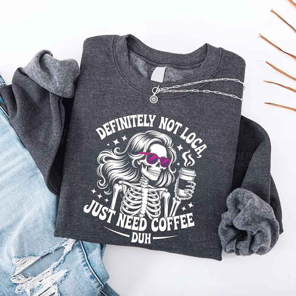 May include a women’s long sleeve shirt with the phrase “Definitely Not Loca” printed on the front in a casual, stylish design.