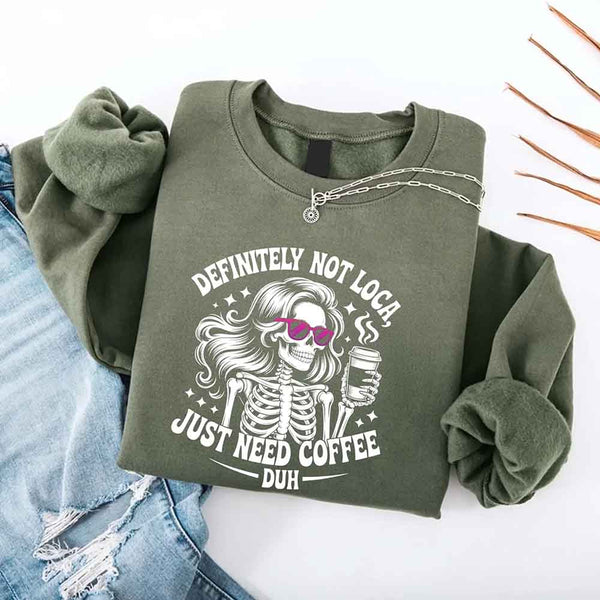 May include a women’s long sleeve shirt with the phrase “Definitely Not Loca” printed on the front in a casual, stylish design.