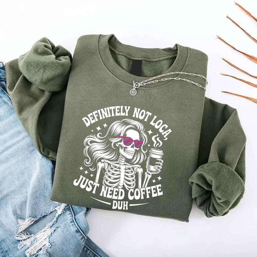 May include a women’s long sleeve shirt with the phrase “Definitely Not Loca” printed on the front in a casual, stylish design.