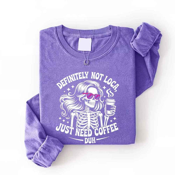 May include a women’s long sleeve shirt with the phrase “Definitely Not Loca” printed on the front in a casual, stylish design.