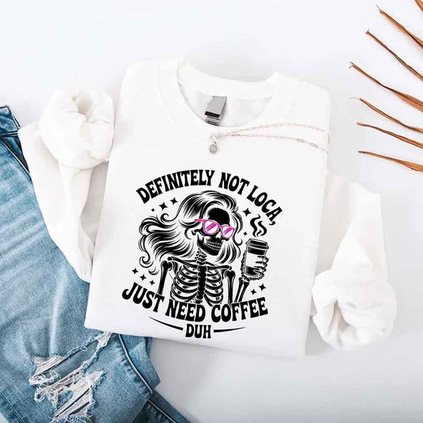 May include a women’s long sleeve shirt with the phrase “Definitely Not Loca” printed on the front in a casual, stylish design.