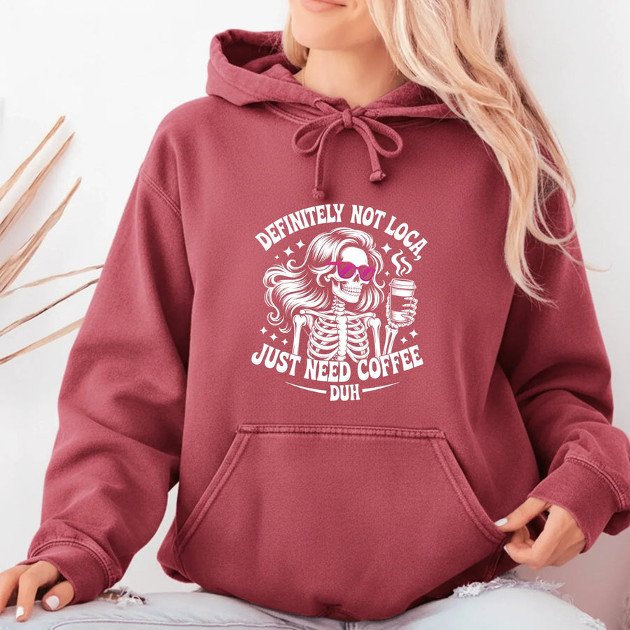 May include a women’s long sleeve shirt with the phrase “Definitely Not Loca” printed on the front in a casual, stylish design.