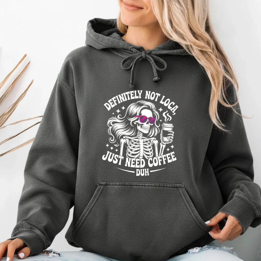 May include a women’s long sleeve shirt with the phrase “Definitely Not Loca” printed on the front in a casual, stylish design.