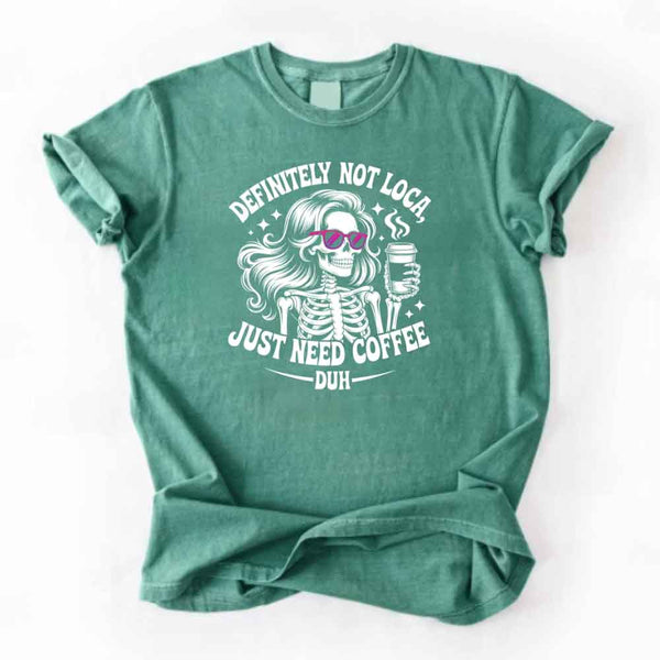 May include a short sleeve graphic tee featuring the phrase “Definitely Not Loca”  on a casual unisex shirt.