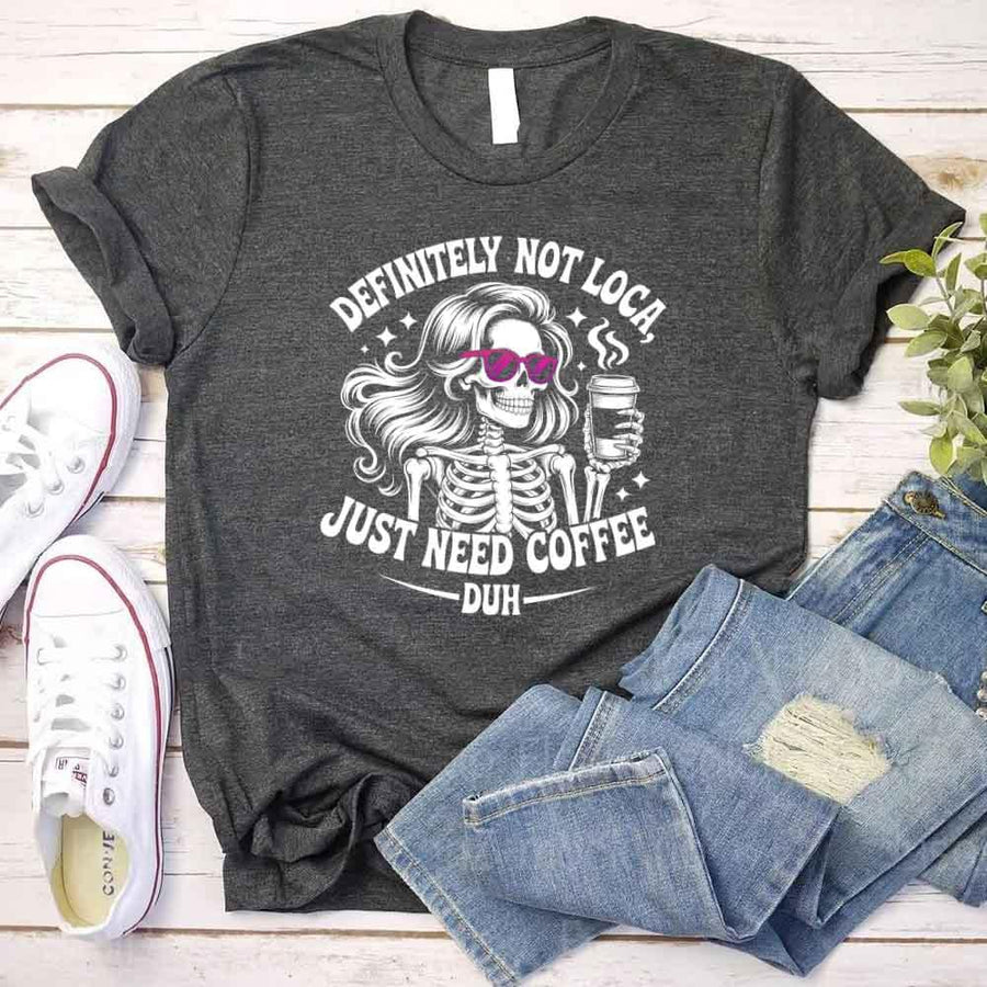 May include a short sleeve graphic tee featuring the phrase “Definitely Not Loca”  on a casual unisex shirt.