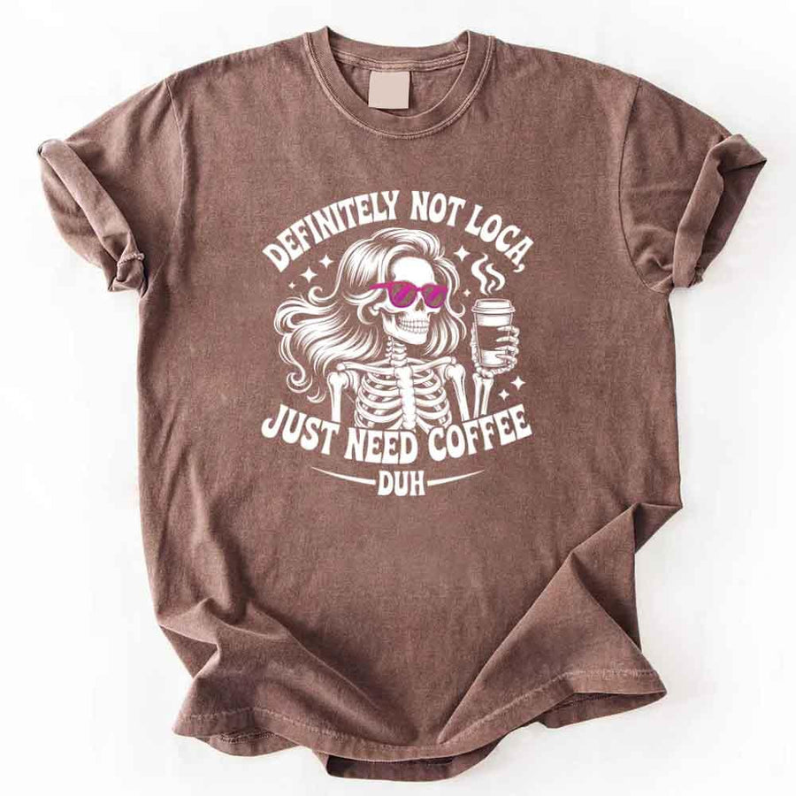 May include a short sleeve graphic tee featuring the phrase “Definitely Not Loca”  on a casual unisex shirt.