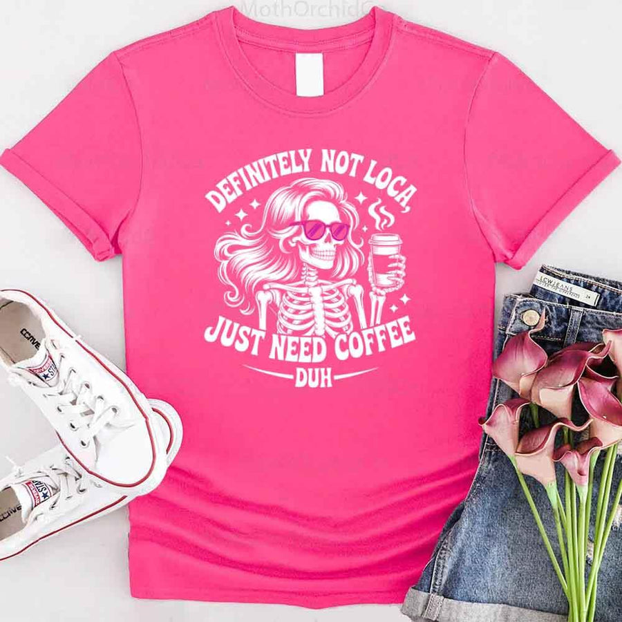 May include a short sleeve graphic tee featuring the phrase “Definitely Not Loca”  on a casual unisex shirt.