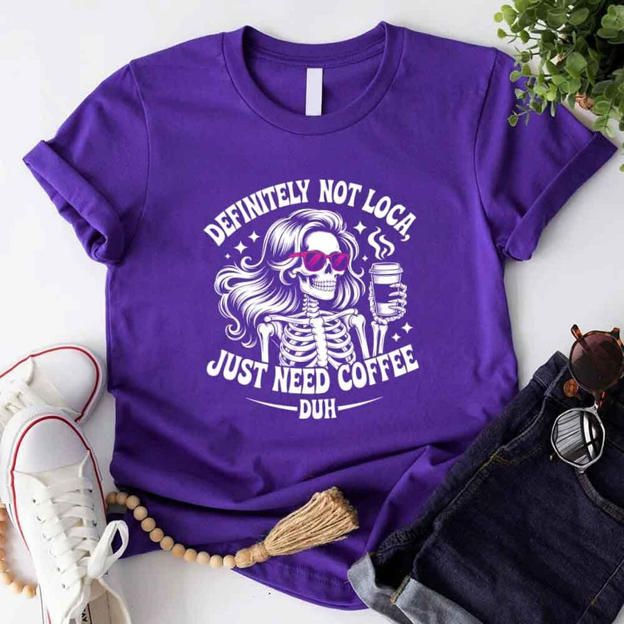 May include a short sleeve graphic tee featuring the phrase “Definitely Not Loca”  on a casual unisex shirt.