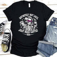 May include a short sleeve graphic tee featuring the phrase “Definitely Not Loca”  on a casual unisex shirt.