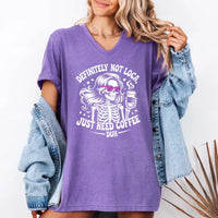 May include a short sleeve graphic tee featuring the phrase “Definitely Not Loca”  on a casual unisex shirt.