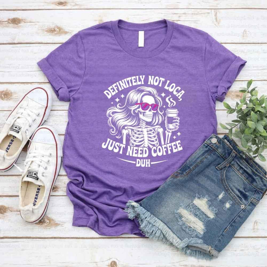 May include a short sleeve graphic tee featuring the phrase “Definitely Not Loca”  on a casual unisex shirt.