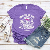 May include a short sleeve graphic tee featuring the phrase “Definitely Not Loca”  on a casual unisex shirt.
