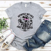 May include a short sleeve graphic tee featuring the phrase “Definitely Not Loca”  on a casual unisex shirt.