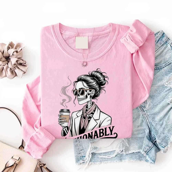 May include a long sleeve shirt featuring the phrase “Fashionably Late” in a stylish, modern font.