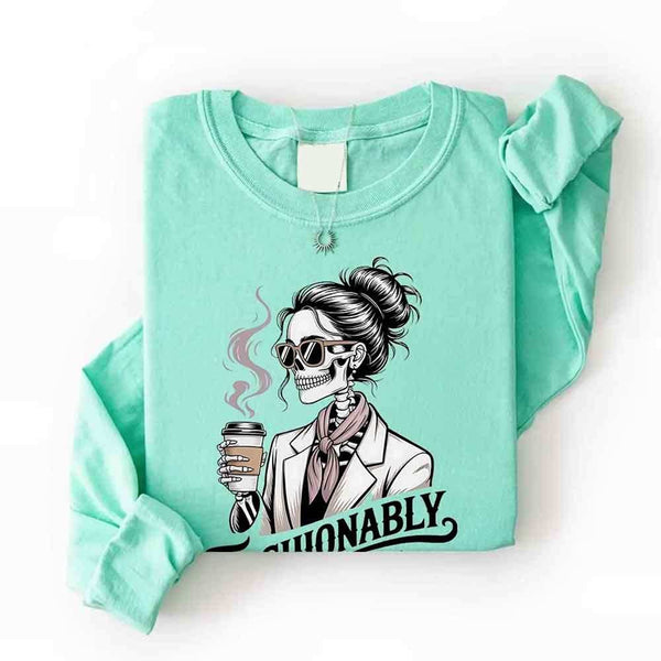 May include a long sleeve shirt featuring the phrase “Fashionably Late” in a stylish, modern font.