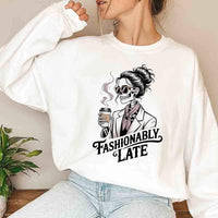 May include a long sleeve shirt featuring the phrase “Fashionably Late” in a stylish, modern font.