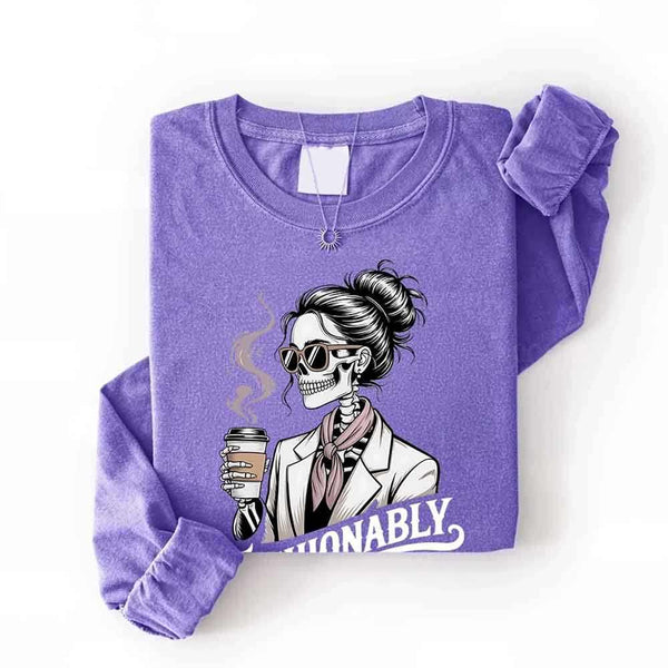 May include a long sleeve shirt featuring the phrase “Fashionably Late” in a stylish, modern font.