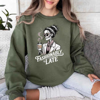 May include a long sleeve shirt featuring the phrase “Fashionably Late” in a stylish, modern font.