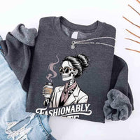 May include a long sleeve shirt featuring the phrase “Fashionably Late” in a stylish, modern font.