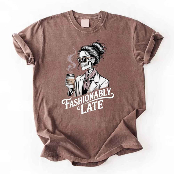 May include a short sleeve shirt featuring the phrase “Fashionably Late” in a stylish, modern font.