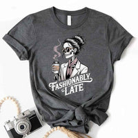 May include a short sleeve shirt featuring the phrase “Fashionably Late” in a stylish, modern font.