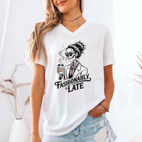May include a short sleeve shirt featuring the phrase “Fashionably Late” in a stylish, modern font.