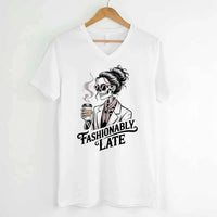 May include a short sleeve shirt featuring the phrase “Fashionably Late” in a stylish, modern font.