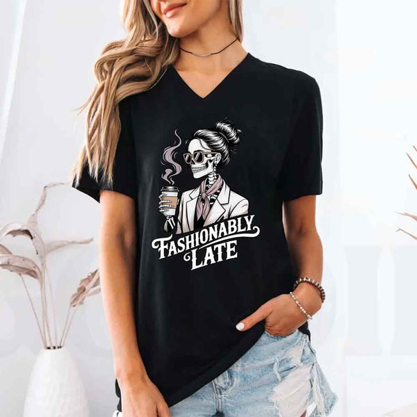 May include a short sleeve shirt featuring the phrase “Fashionably Late” in a stylish, modern font.