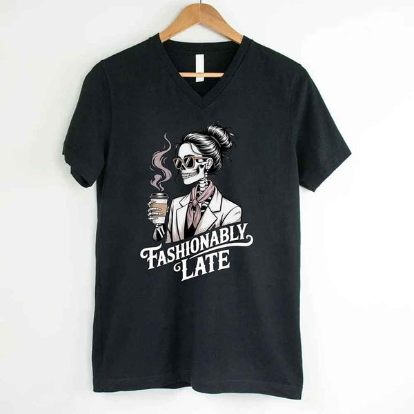 May include a short sleeve shirt featuring the phrase “Fashionably Late” in a stylish, modern font.