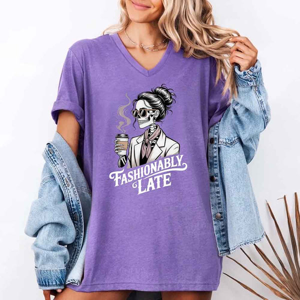 May include a short sleeve shirt featuring the phrase “Fashionably Late” in a stylish, modern font.