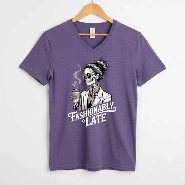 May include a short sleeve shirt featuring the phrase “Fashionably Late” in a stylish, modern font.