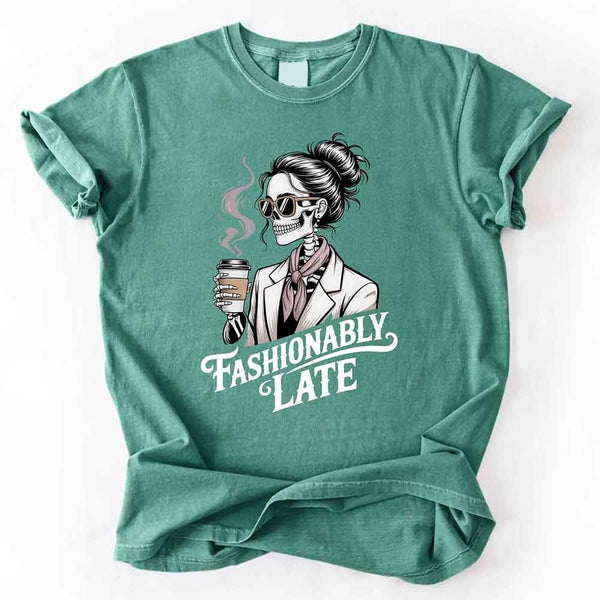 May include a short sleeve shirt featuring the phrase “Fashionably Late” in a stylish, modern font.