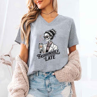 May include a short sleeve shirt featuring the phrase “Fashionably Late” in a stylish, modern font.