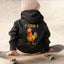 May include a kids’ unisex hoodie featuring a bold “F-Caw-F” chicken graphic printed on the back of a soft cotton-blend fabric.