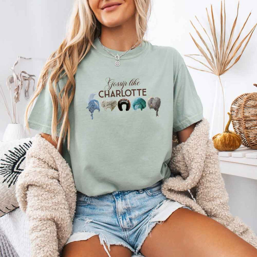 May include a person wearing a Bay Gossip Like Charlotte Wigs Comfort Colors T-Shirt featuring historical drama inspired graphic and relaxed fit.