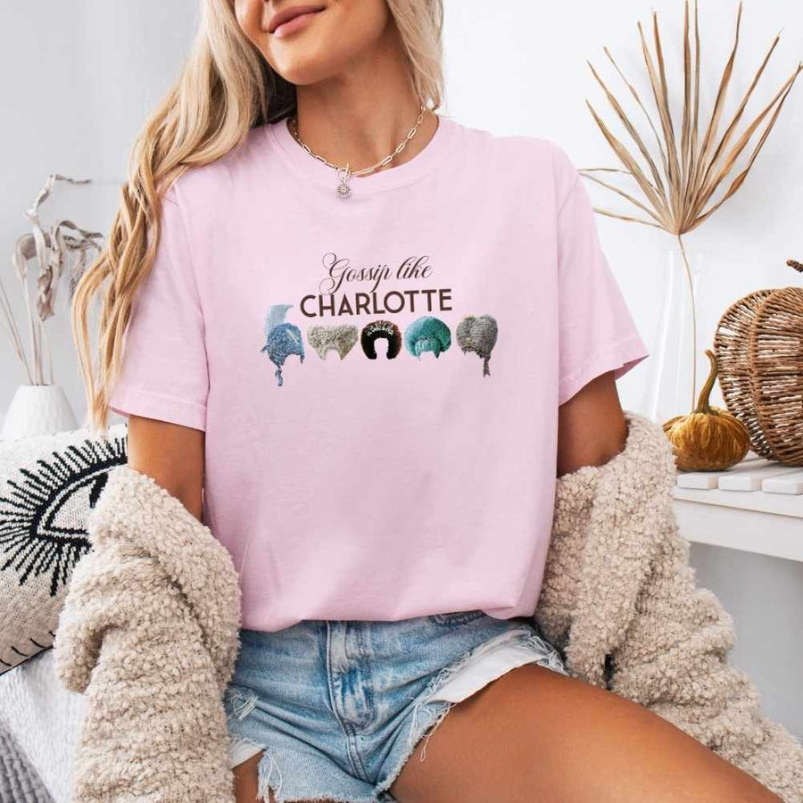 May include a person wearing a Blossom Gossip Like Charlotte Wigs Comfort Colors T-Shirt featuring historical drama inspired graphic and relaxed fit.