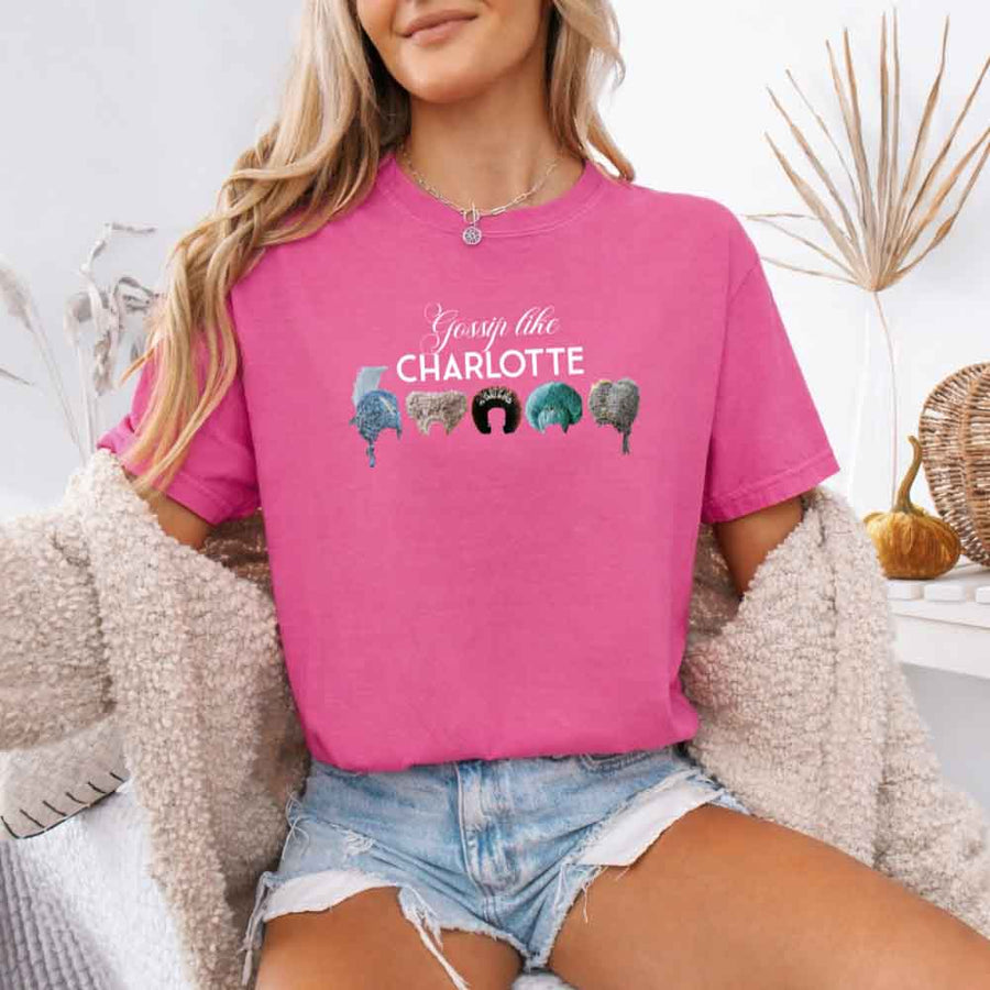 May include a person wearing a Crunchberry Gossip Like Charlotte Wigs Comfort Colors T-Shirt featuring historical drama inspired graphic and relaxed fit.