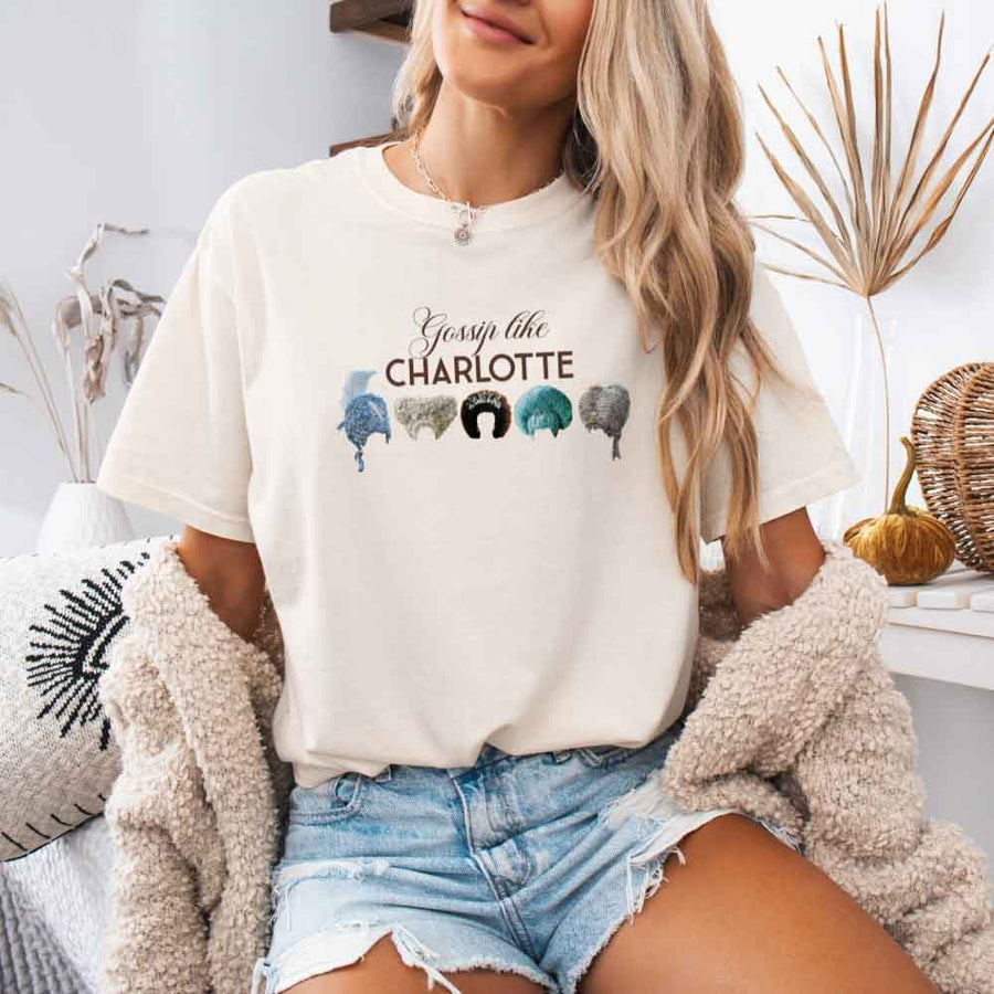 May include a person wearing an Ivory Gossip Like Charlotte Wigs Comfort Colors T-Shirt featuring historical drama inspired graphic and relaxed fit.
