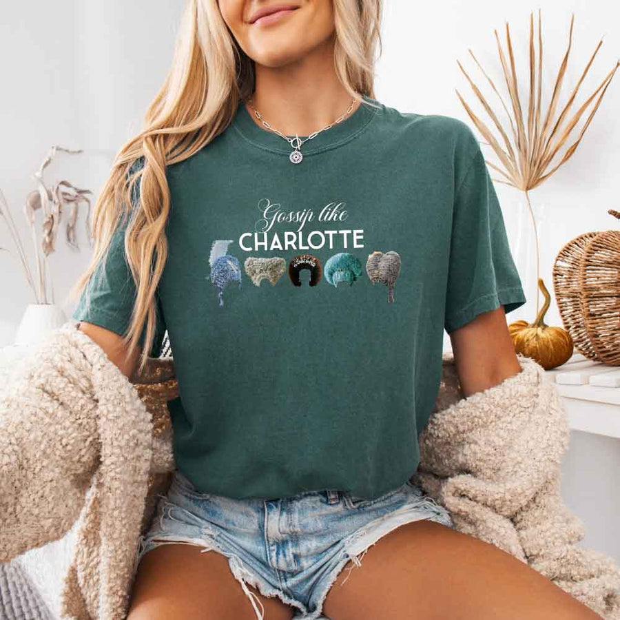 May include a person wearing a Blue Spruce Gossip Like Charlotte Wigs Comfort Colors T-Shirt featuring historical drama inspired graphic and relaxed fit.