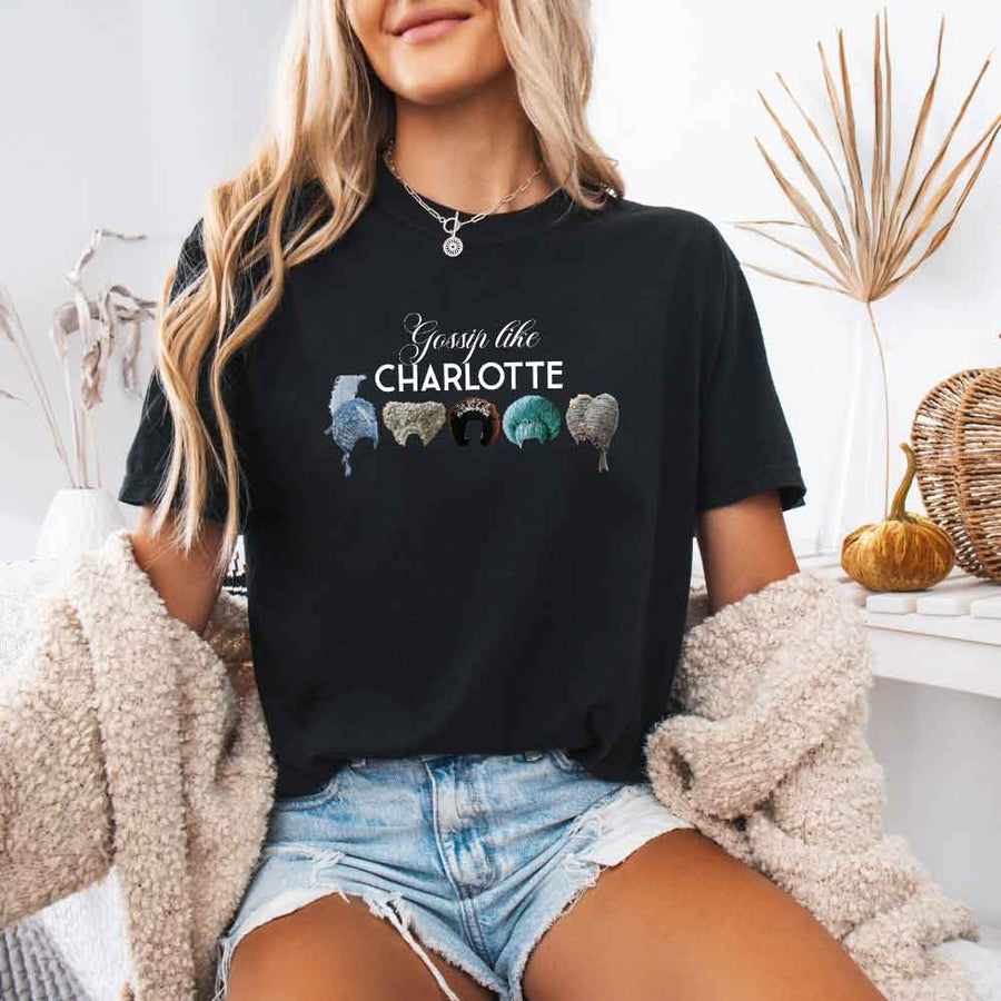 May include a person wearing a Black Gossip Like Charlotte Wigs Comfort Colors T-Shirt featuring historical drama inspired graphic and relaxed fit.