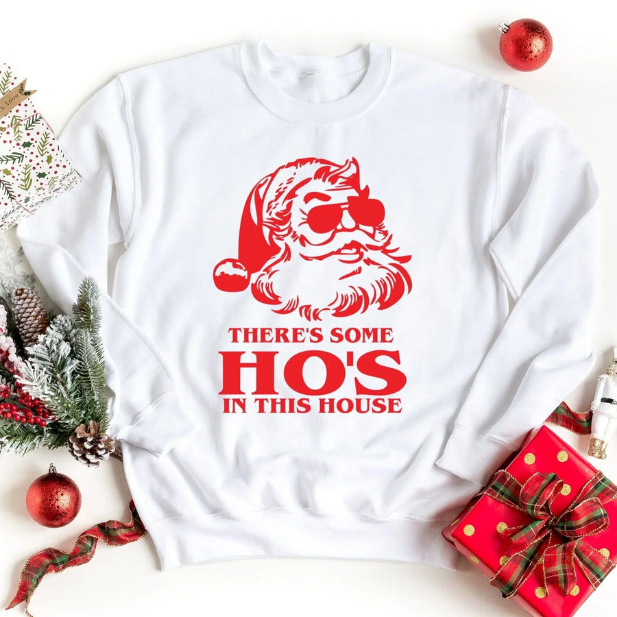White Christmas sweatshirt with red Santa graphic and festive holiday decorations