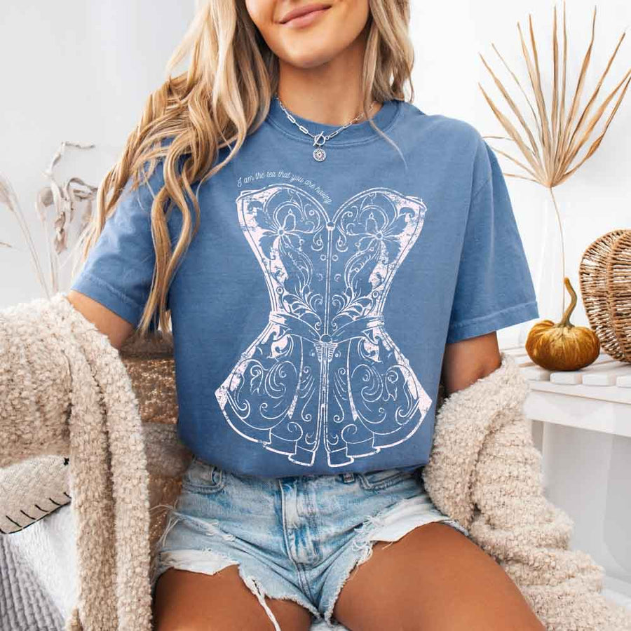 May include a person wearing a Blue Jean I Am The Tea That You Are Having Comfort Colors T-Shirt featuring royal court inspired graphic and relaxed fit.
