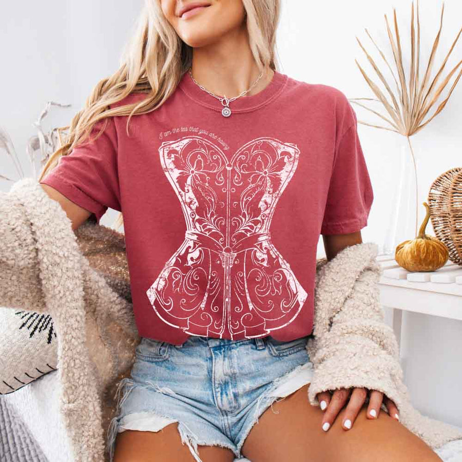 May include a person wearing a Crimson I Am The Tea That You Are Having Comfort Colors T-Shirt featuring royal court inspired graphic and relaxed fit.