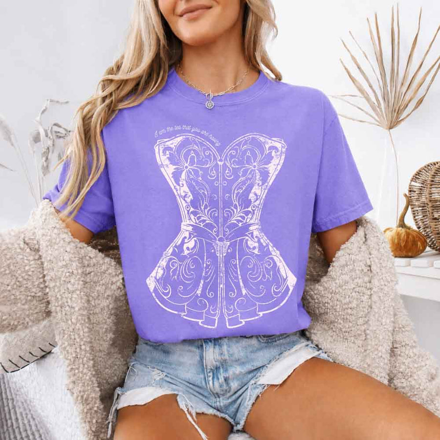 May include a person wearing a Violet I Am The Tea That You Are Having Comfort Colors T-Shirt featuring royal court inspired graphic and relaxed fit.